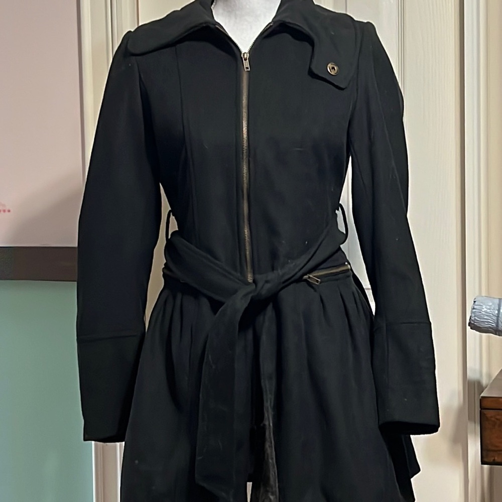 Black jacket lined with zipper and tie front